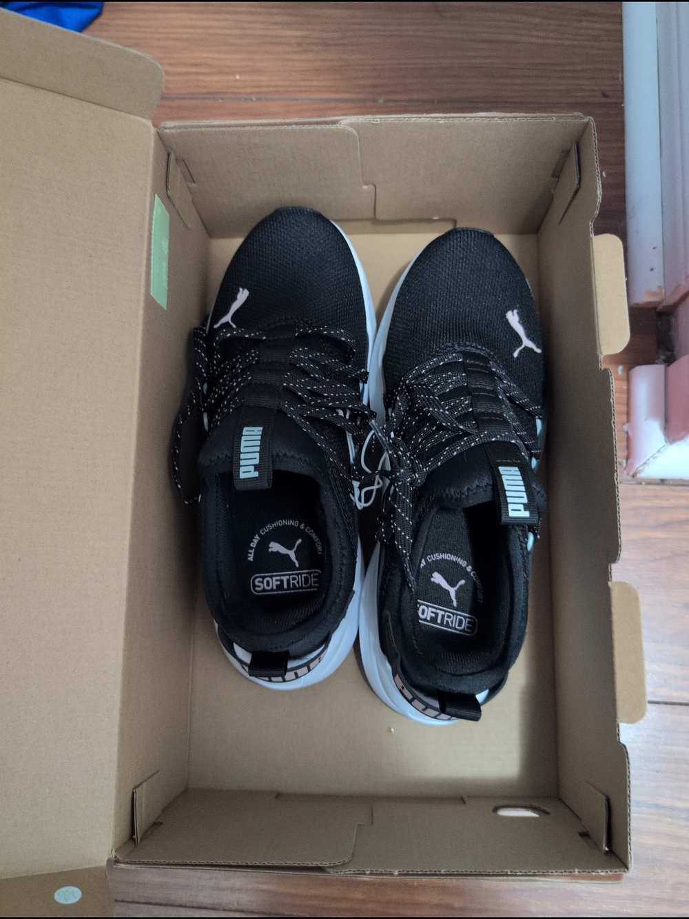 Puma Women Black and White SoftRide Sneakers